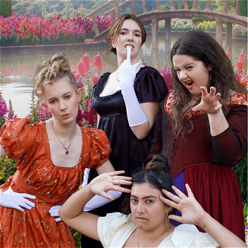 Four women in Austen-style dresses, doing modern sassy poses